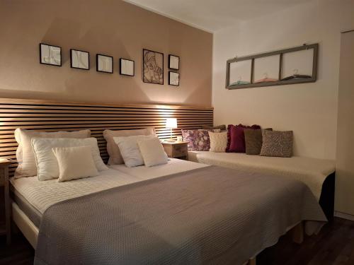 two beds in a room with two beds sidx sidx sidx sidx at Studio Apartment MD in Roč