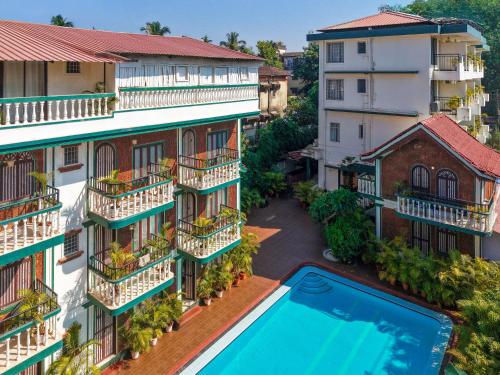 an aerial view of a building with a swimming pool at Olive Zip Calangute Mira by Embassy Group in Calangute