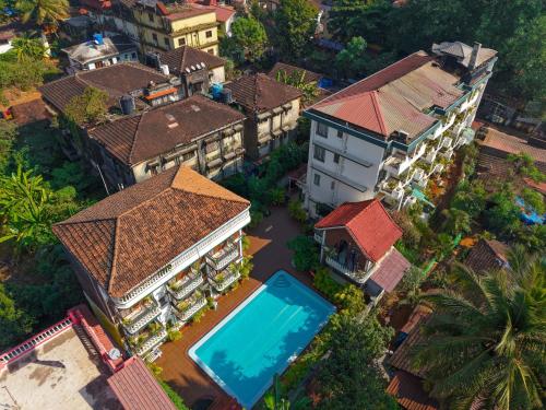 an overhead view of a house with a swimming pool at Olive Zip Calangute Mira by Embassy Group in Calangute
