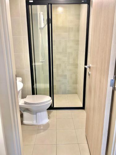 a bathroom with a toilet and a shower at Dcondo Reef Serenity Condo 2 in Phuket