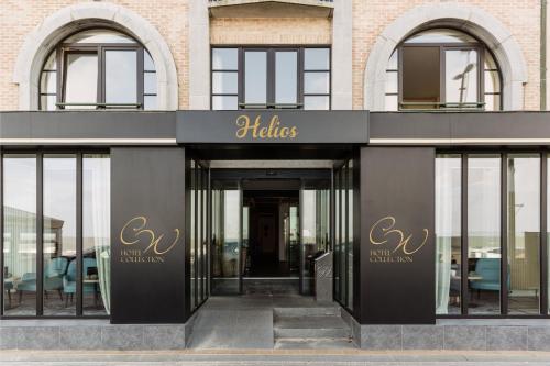a store front of a building with glass doors at Beach Hotel Helios by CW Hotel Collection in Blankenberge