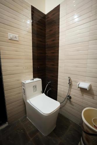 a bathroom with a toilet and a sink at Hotel Blessing Inn in Jalandhar
