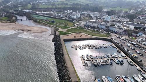 an aerial view of a marina with boats in the water at Marine Hotel Ballycastle in Ballycastle