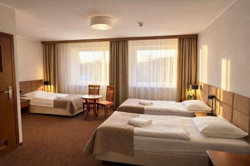 Llit o llits en una habitació de Załęże