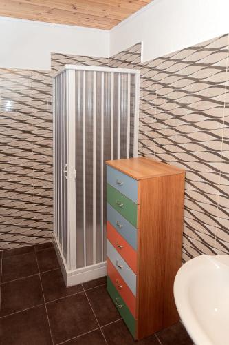 a bathroom with a sink and a cabinet at Bed and Breakfast Brezza Marina 2 in Mattinata