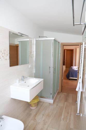 a bathroom with a sink and a mirror at Hotel Massimino in Anguillara Sabazia