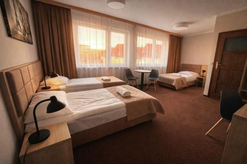 Llit o llits en una habitació de Załęże