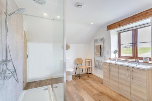 a bathroom with a shower and a sink at 3 Bed in Bish Mill oc-e30946 in Bishops Nympton