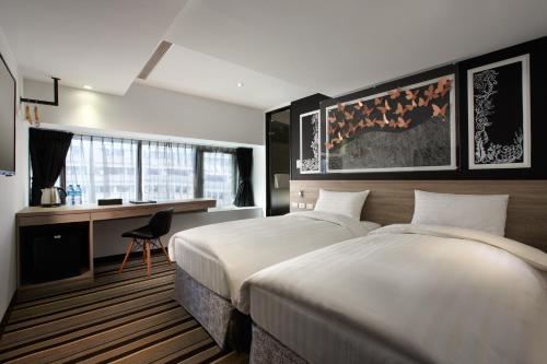 Postel nebo postele na pokoji v ubytování RF Hotel - Zhongxiao