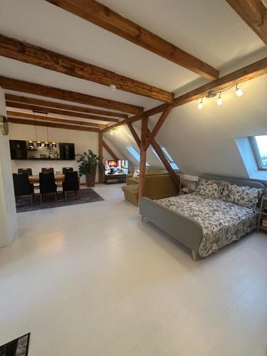 a bedroom with a bed and a dining room at Gemütliche Wohnung in Burg in Burg bei Magdeburg