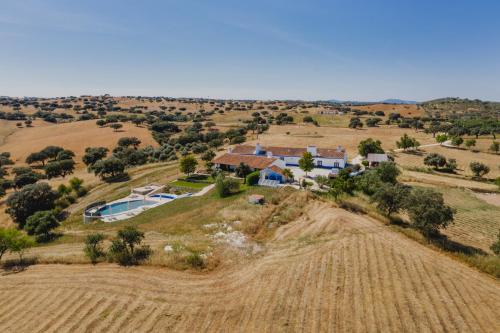 an aerial view of a home in a field at Herdade dos Mestres in Terena