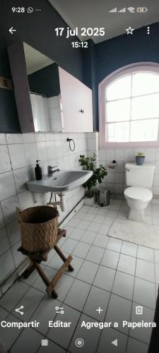 a bathroom with a sink and a toilet at 566 Hostel in La Serena