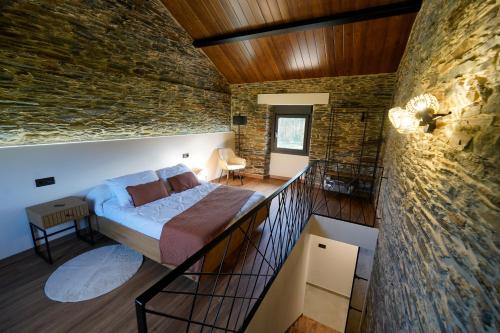 a bedroom with a bed on a balcony at Casa Rural Lugar Vista Alegre in Lugo