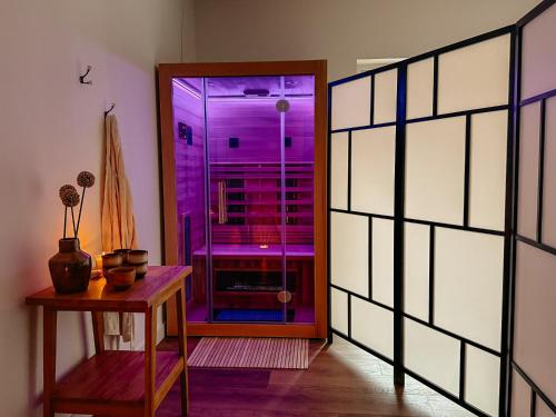 a room with a glass door and a table at Agroturystyka Kaczor nad jeziorem in Męcidół