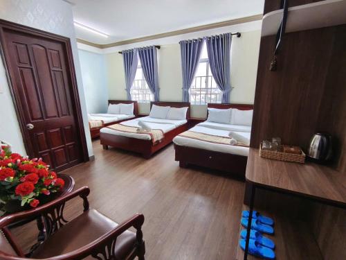 a large living room with couches and a couch at The Cloud Hotel in Da Lat