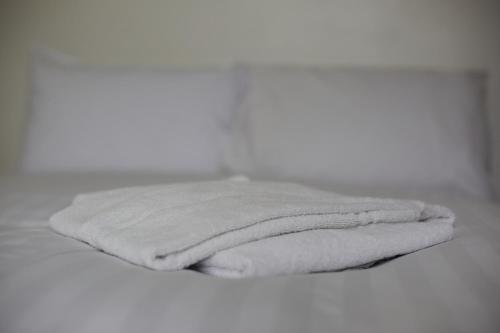 a stack of towels sitting on top of a table at Hayy Studios Blackhouse in Huddersfield