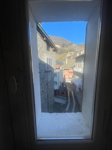 a view through a window of a building at Ca Sunder in Sondrio
