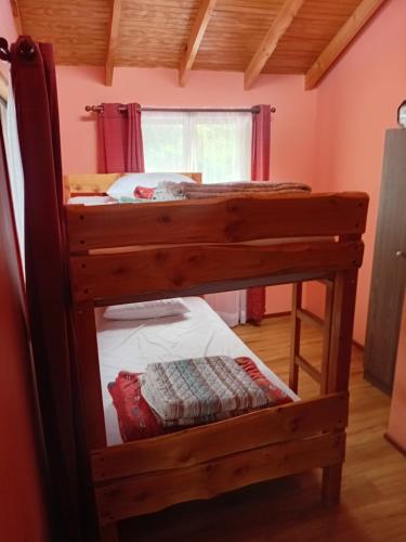 a couple of bunk beds in a room at Casa Lago Caburgua in Pucón