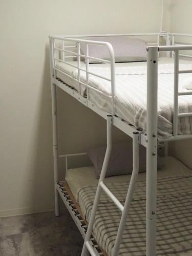 a couple of bunk beds in a room at Phoenix Inn in Tokyo