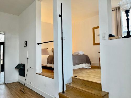 a room with a sliding door leading to a bedroom at De Hoffstee in Minnertsga