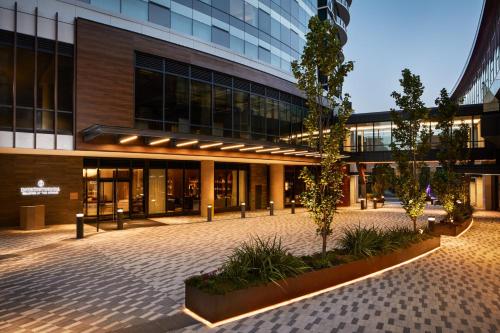 a building with a courtyard in front of it at InterContinental Seattle Bellevue, by IHG in Bellevue