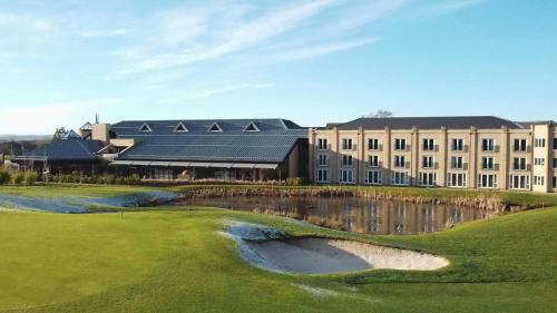 a golf course with a hotel in the background at Ramside Hall Hotel, Golf & Spa in Durham