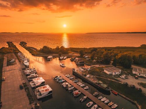 an aerial view of a marina at sunset at Marina Martinshafen in Sassnitz
