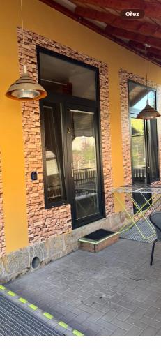 a front porch of a house with a black door at UbytkoMácháč in Staré Splavy