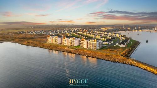 an aerial view of a city next to a body of water at Penthouse Hygge Meerblick - Olpenitz in Olpenitzdorf