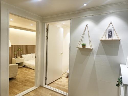 a room with a sliding door and a bedroom at Gwanganli Breeze Bay in Kwangan-dong