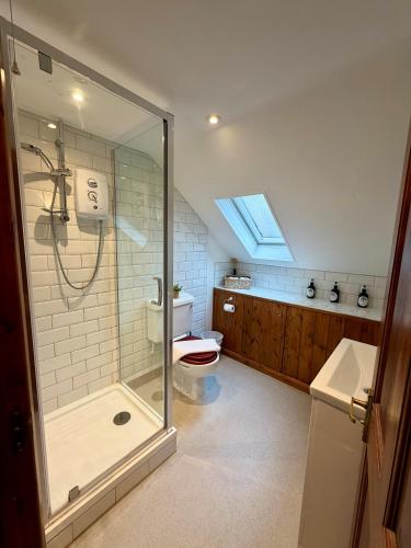 a bathroom with a shower and a toilet at The Pear Tree in Hook Norton