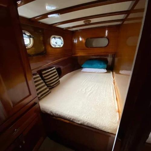 a small bed in the back of a boat at YourTourKey Gulet Accommodation in Güvercin Adası