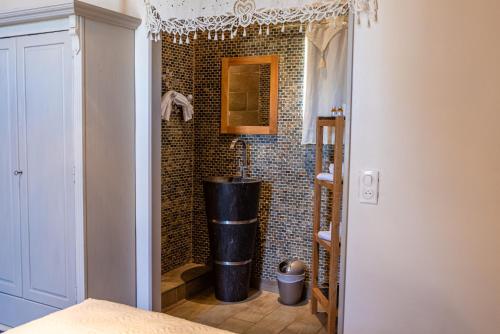a bathroom with a shower with a tub at Domaine De Blancardy in Moulès-et-Baucels