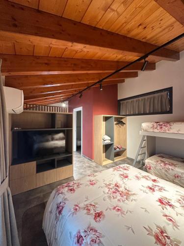 a bedroom with a bed and a fireplace in a room at Terrazza Retica in Piateda