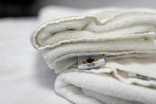 a stack of white towels with a tag on them at Panoramic View Bran Rooms in Bran
