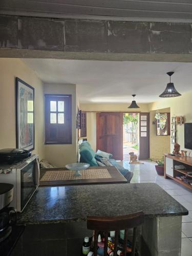a living room with a couch and a table at Casa para Carnaval in Olinda