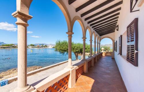 a building with a view of the water at Es Clot in Alcudia