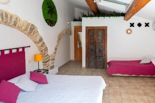 a bedroom with two beds in a room at Domaine De Blancardy in Moulès-et-Baucels