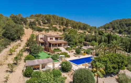 an aerial view of a house with a swimming pool at Casa Amorena in Felanitx