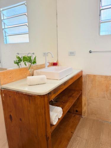 a bathroom with a sink and a mirror at Rede Andrade Calamarina in Jericoacoara