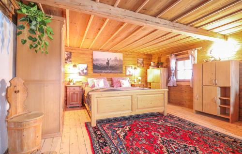 a bedroom with a bed and a rug in a room at Charmantes Ferienhaus in Schwendt