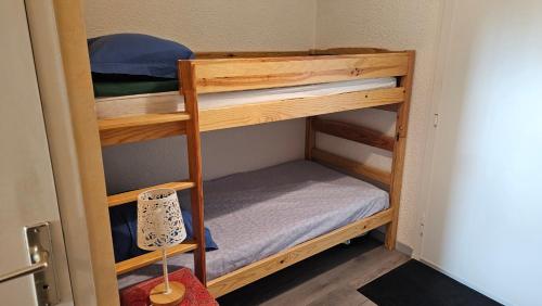 a couple of bunk beds in a room at Col de L'Arzelier in Château-Bernard
