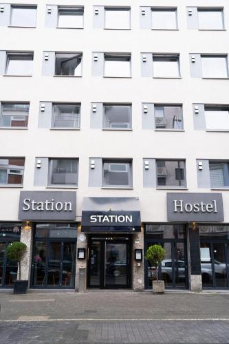 a white building with the front of a hospital at Station - Hostel for Backpackers in Cologne