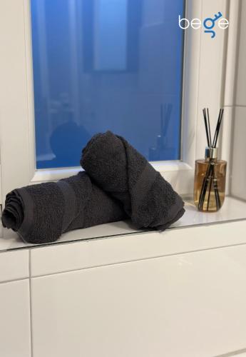 a stuffed animal is sitting on a window sill at BEGE APARTMENTS Next Level Sleep in Niederdorla