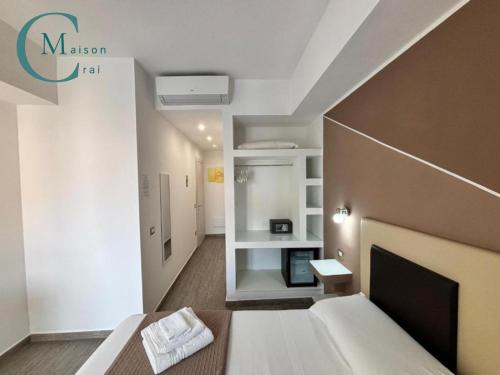 a room with a bed and a living room at Residenza Magnolia in Tropea