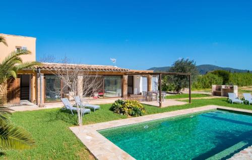 a villa with a swimming pool and a house at Ca Ses Nines in Cala Bona