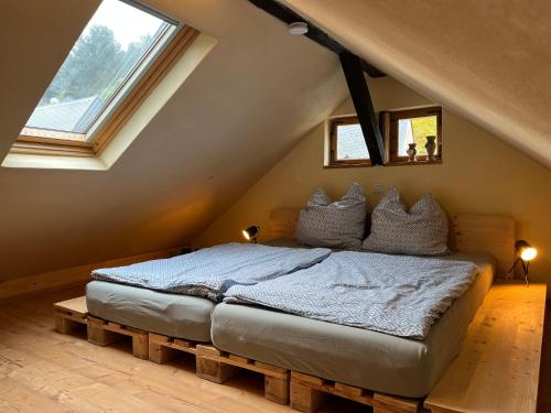 a bedroom with a bed in a attic at Ferienhaus Königstein in Königstein an der Elbe