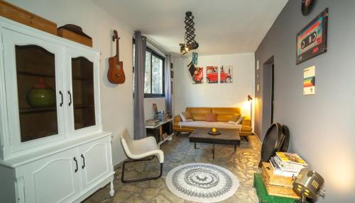 a living room with a couch and a table at Lux Apartment Sunset in Virpazar