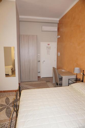 Ein Bett oder Betten in einem Zimmer der Unterkunft Residence Stendhal Guest House