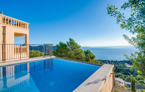 a swimming pool with a view of the ocean at Ventimar in Canyamel